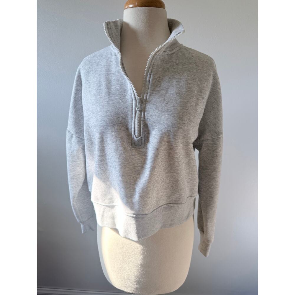 Women’s Fabletics quarter zip sweater size 
Xsmall